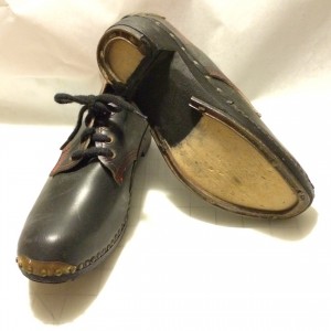 black clogs with irons