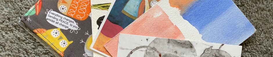 An array of handmade postcards, done with collage, fabric, printing, and watercolor